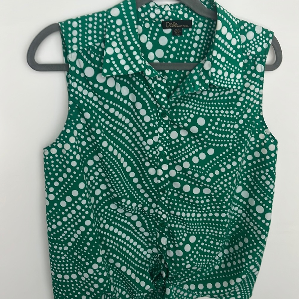 Green and white polka dot blouse